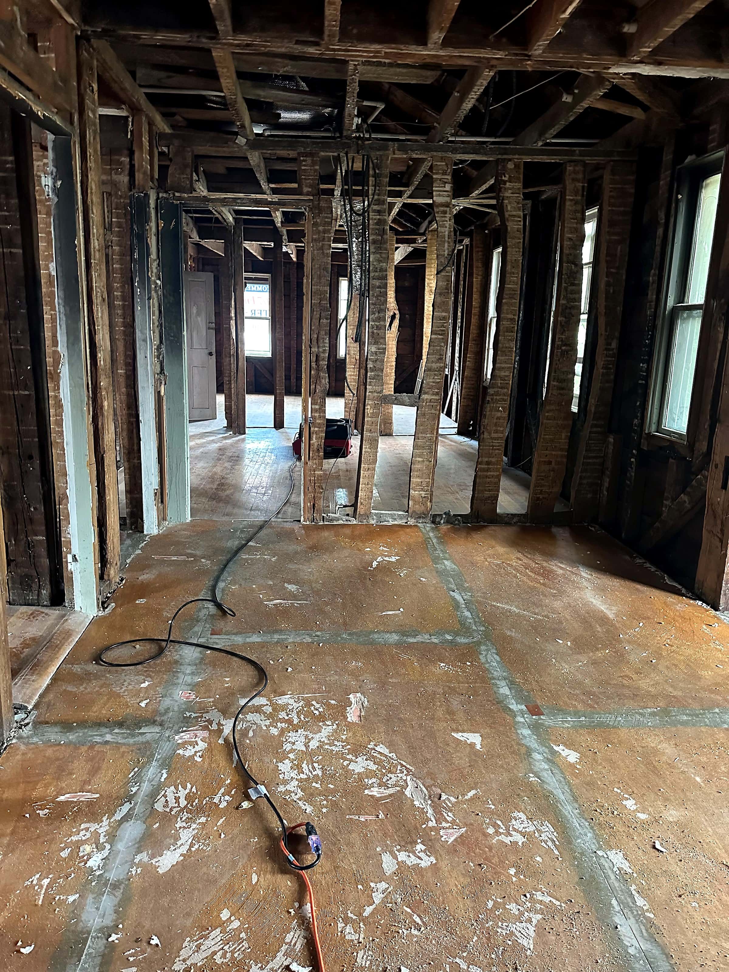 A building interior taken down to its framing during reconstruction.